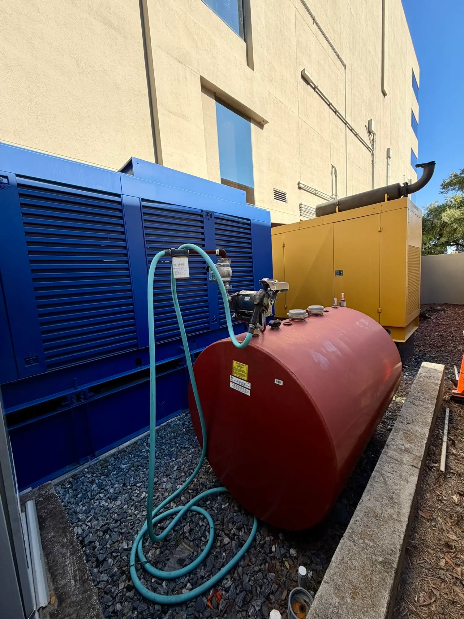 Standby generator and fuel tank at the facility