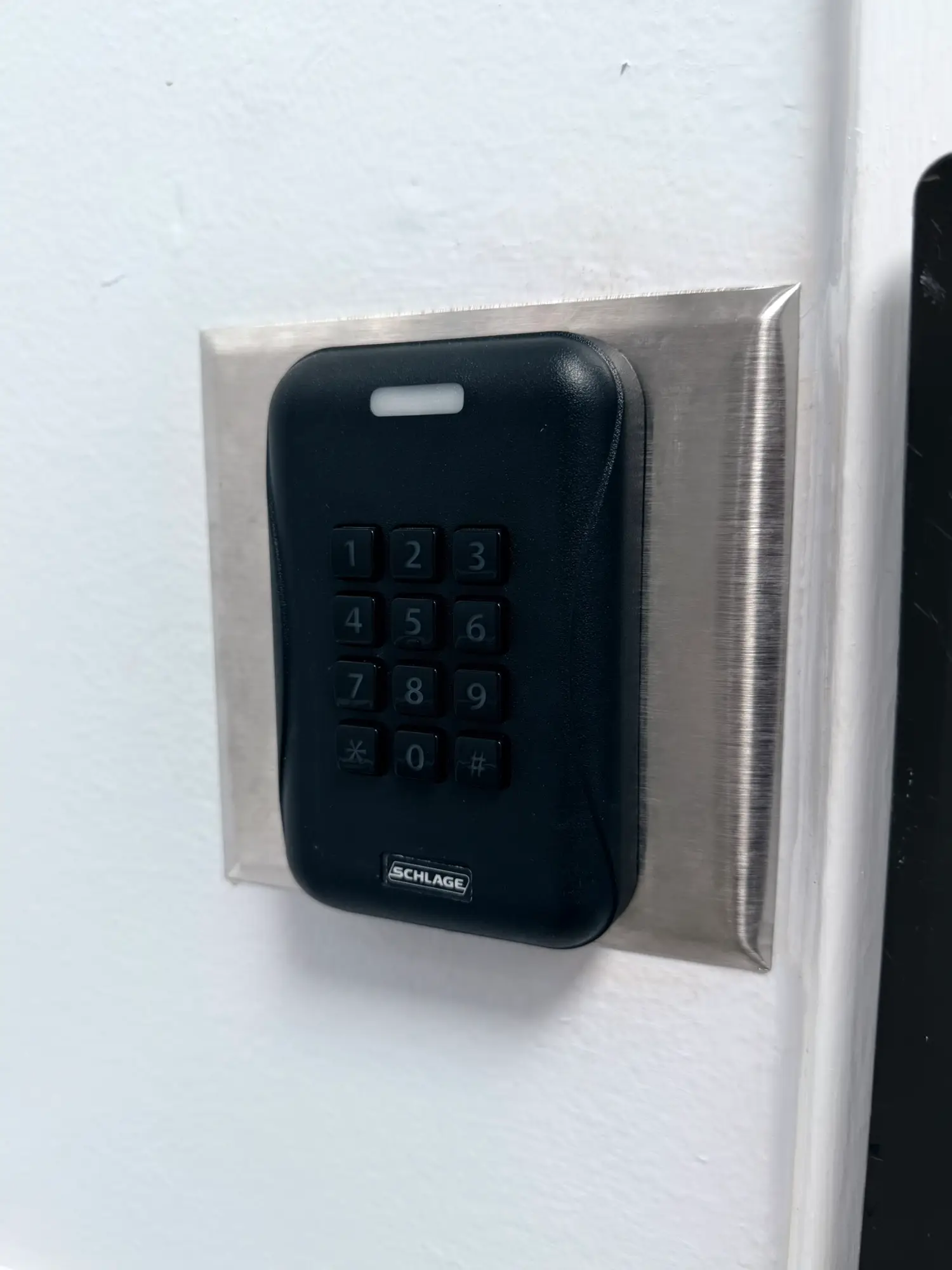 Proximity card reader with PIN keypad at a facility door